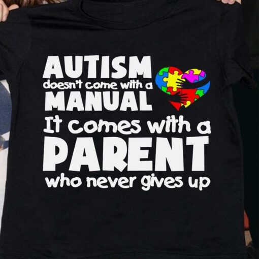 Autism Doesn’t Come With A Manual It Comes With A Parent Who Never Gives Up Black Hands Holding Autism Heart Shirt