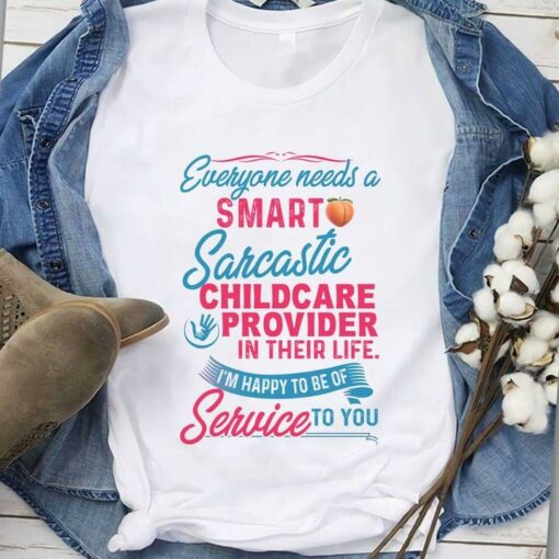 Everyone Needs A Smart Sarcastic Childcare Provider In Their Life I’m Happy To Be Of Service To You Peach Hands Holding Shirt